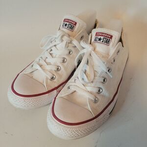Converse All Star White Canvas Sneakers with Red Trim And Some Coffeeshop Decor